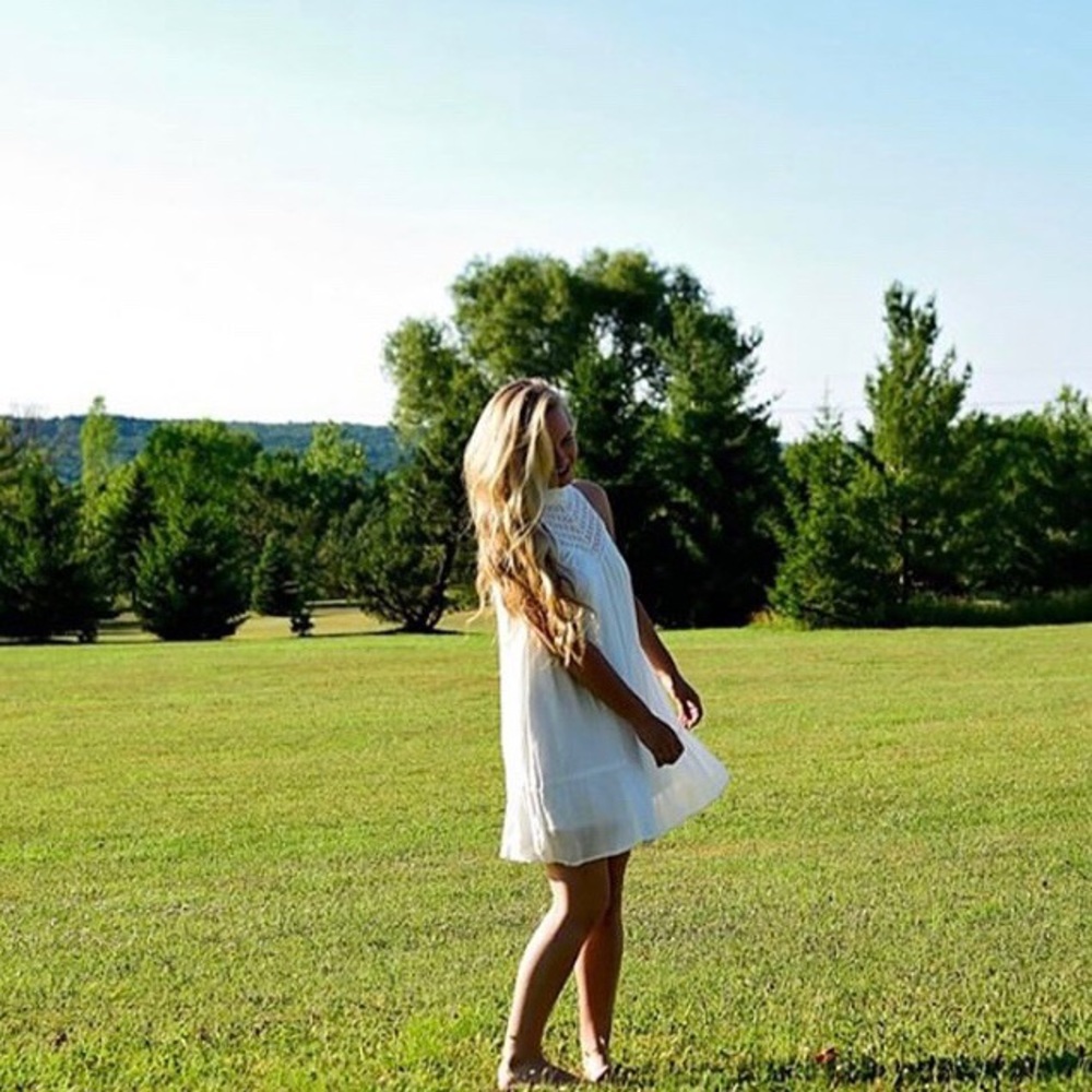 A white high necked flowy dress